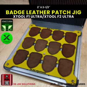 A top-down view of the xTool F1 Ultra Badge Hat Patch Jig holding multiple blank badge-shaped leatherette patches.