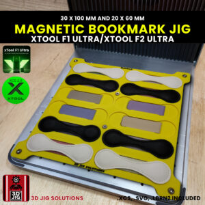 A top-down view of the xTool F1 Ultra Bookmark Jig holding multiple blank magnetic leather bookmarks of both 30x100mm and 20x60mm sizes.