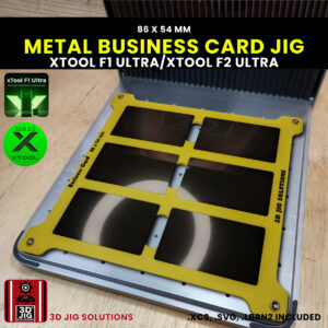 A top-down view of the xTool F1 Ultra Metal Business Card Jig loaded with 6 blank anodized aluminum business cards.