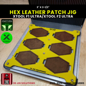 A top-down view of the xTool F1 Ultra Hex Patch Jig holding multiple blank hexagonal leatherette patches.