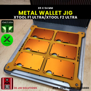 A top-down view of the xTool F1 Ultra Metal Wallet Jig loaded with multiple blank Ridge-style metal wallets (85x54 mm).