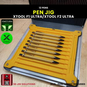 A top-down view of the xTool F1 Ultra Pen Jig loaded with multiple blank bamboo pens