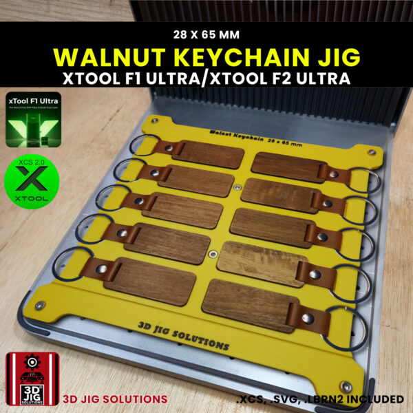A top-down view of the xTool F1 Ultra Rectangle Keychain Jig loaded with 10 blank walnut wood keychains