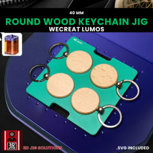 A top-down view of the WeCreat Lumos round keychain jig holding four 40mm bamboo keychains.