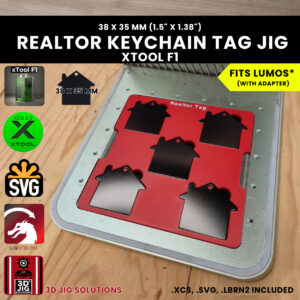 A top-down view of the xTool F1 Realtor keychain jig holding five house-shaped key tags.