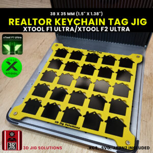 A top-down view of the xTool F1 Ultra Realtor Keychain Jig loaded with 25 blank house-shaped metal tags.