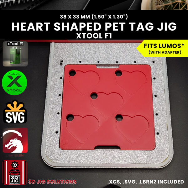 Close-up shot of the laser engraving jig with a laser-engraved heart pet tag, showing the detailed and perfectly centered design.