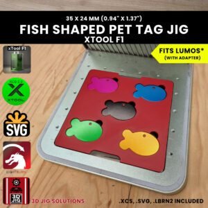 A top-down view of the xTool F1 Fish Pet Tag Laser Engraving Jig holding eight blank fish-shaped metal tags.